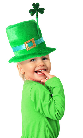 Happy smiling two year old girl wearing a St Patrick