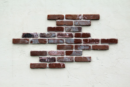Stucco and brick wall.