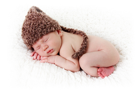 Newborn baby boy, ten days old, asleep on a blanket. の写真素材