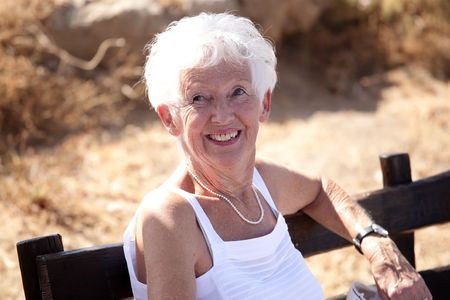 Portrait of a happy senior woman relaxing outdoors
