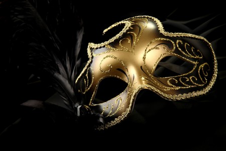 ornate carnival mask over black silk backgroundの写真素材