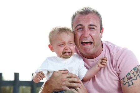 big boys do cry! - young father and his baby son crying togetherの写真素材