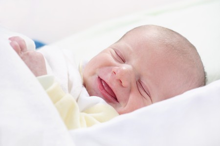 newborn baby laughingの写真素材