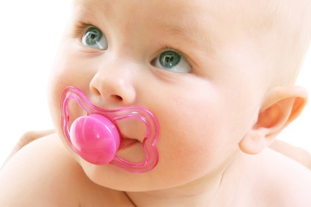 close-up of a cute baby girl over white background
