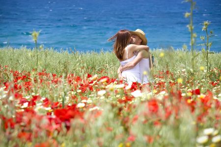 Happy young couple on a meadowの写真素材