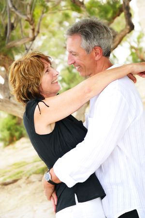 beautiful mature couple looking in each other's eyesの写真素材