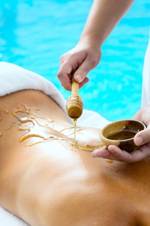 Back of a young woman getting a spa treatmentの写真素材