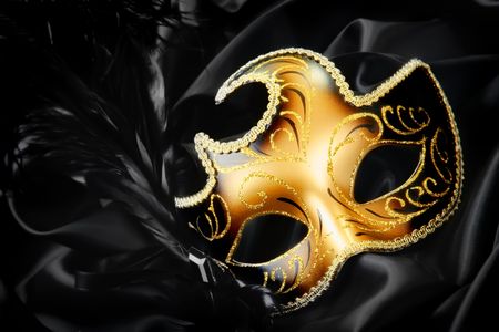 Carnival mask on black silk backgroundの写真素材