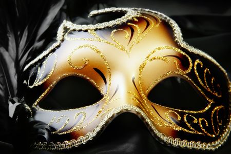 Carnival mask on black silk backgroundの写真素材