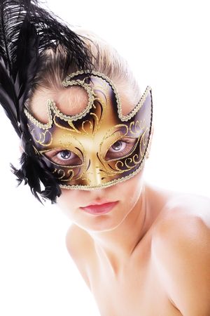 Beautiful young woman in carnival mask. Isolated on white background.の写真素材