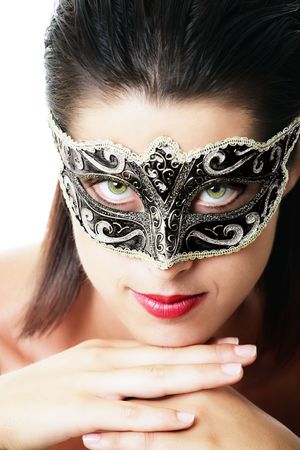 Beautiful young woman in carnival mask. Isolated on white background.の写真素材