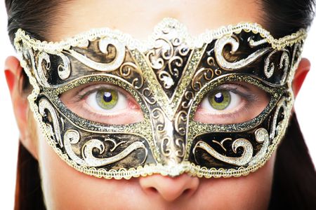 Close-up of a beautiful young woman in carnival maskの写真素材