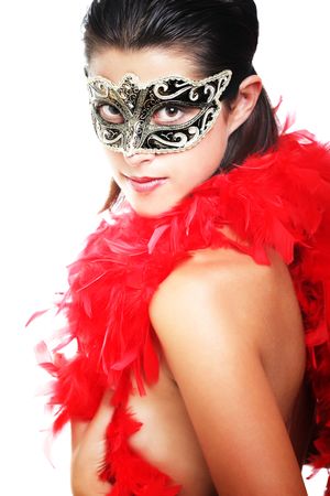 Beautiful young woman in carnival mask and feather boaの写真素材