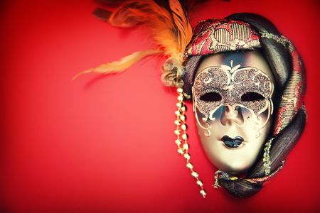Ornate carnival mask over red backgroundの写真素材