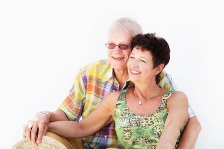 Mature couple smiling and embracingの写真素材