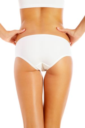 Slim tanned woman's body. Isolated on white.の写真素材