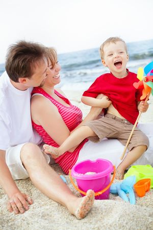 Happy family having fun on the beach.の写真素材