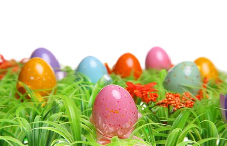 Colorful Easter Eggs On Green Grass. Isolated on white.の写真素材