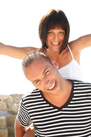 Portrait of a happy young couple having fun outdoors.の写真素材