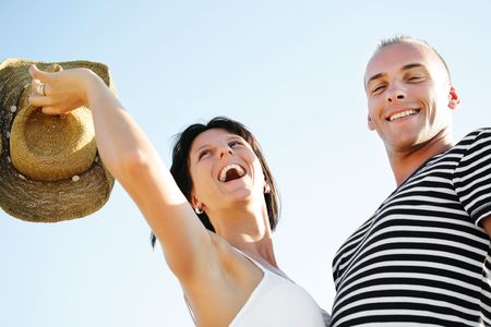 Portrait of a happy young couple having fun outdoors. の写真素材