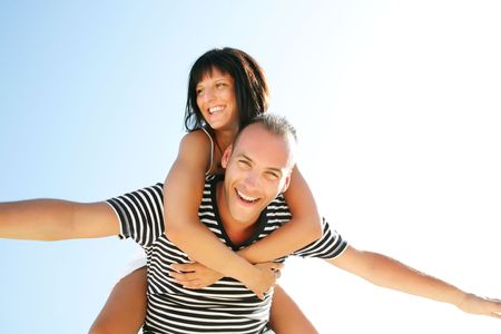 Portrait of a happy young couple having fun outdoors. の写真素材