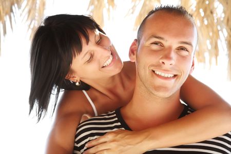 Portrait of a happy young couple enjoying summer holidays.の写真素材