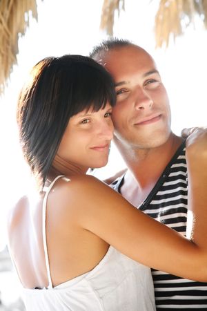 Portrait of a happy young couple enjoying summer holidays.の写真素材