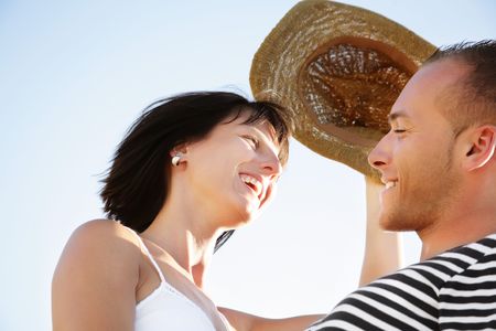 Portrait of a happy young couple having fun outdoors. の写真素材
