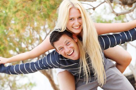 Young couple having fun. Shallow DoF with focus on the man.の写真素材