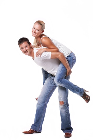 Happy young couple. Isolated over white background.の写真素材