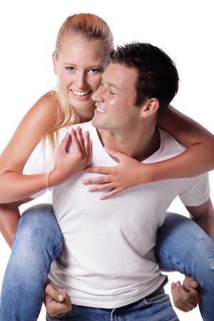 Happy young couple. Isolated over white background.の写真素材