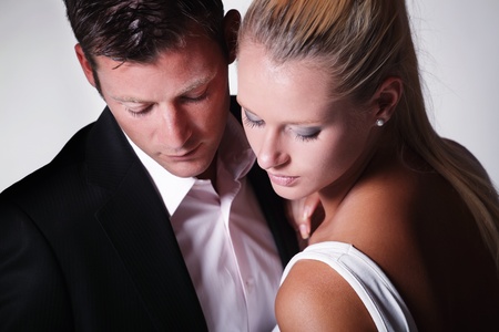 Attractive young couple. Studio portrait on grey background.の写真素材