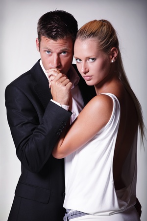 Attractive young couple. Studio portrait on grey background.の写真素材