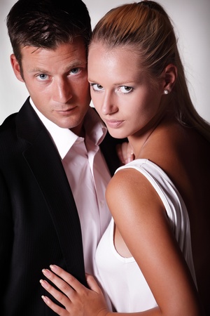 Attractive young couple. Studio portrait on grey background.の写真素材
