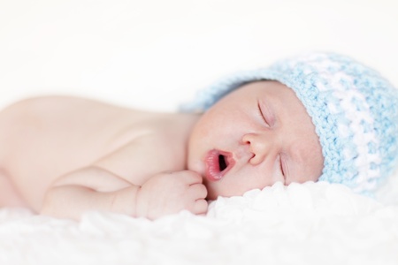 Newborn baby sleeping. Soft focus, shallow DoF.の写真素材