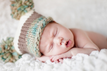 Newborn baby sleeping. Soft focus, shallow DoF.の写真素材