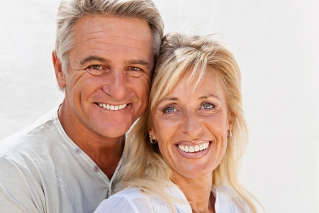Mature couple smiling and embracingの写真素材