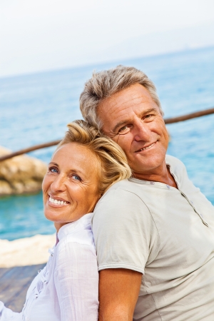 Mature couple smiling and embracingの写真素材