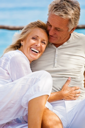 Mature couple smiling and embracingの写真素材