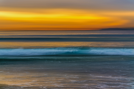 Sunset over the sea, beautiful gold and blue colors, abstractの写真素材