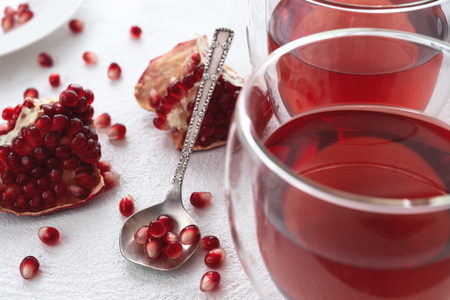 Pomegranate, Pomegranate seeds and Pomegranate tea, Beautiful White Background, Close Upの写真素材