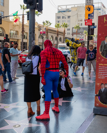 Hollywood Walk of Fame. Street artists, and tourists walking and taking photos on Hollywood Boulevard, Los Angeles, October 14, 2016のeditorial素材