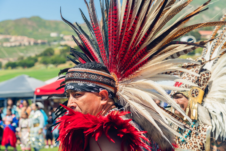 A native American man in full regalia dances at 2019 21st Annual Chumash Day Powwow and Intertribal Gathering, Malibu, California, April 13, 2019のeditorial素材