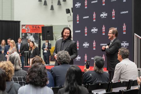 Keanu Reeves. Actor's Handprints and Footprints Cemented on Hollywood Boulevard. Chinese Theater Event, Guests, Celebrities, Halle Berry, Laurence Fishburne.  Hollywood, California, USA, May 14, 2019のeditorial素材