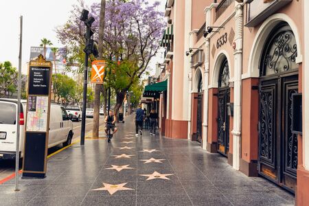 Hollywood Walk of Fame at Morning. Hollywood, Los Angeles with tourists walking on the stars. Los Angeles, Hollywood, California, USA, May 14, 2019のeditorial素材