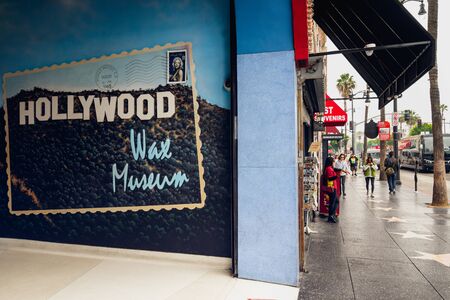Hollywood Walk of Fame at Morning. Corner of Hollywood Wax Museum and tourists walking on the stars. Los Angeles, Hollywood, California, USA, May 14, 2019のeditorial素材