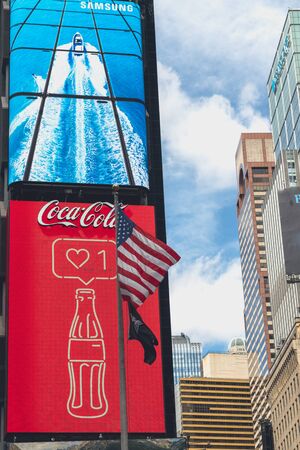 Times Square, NYC. Neon Art, Billboards, Skyscrapers, Coca Cola Logo and American Flag. Times Square is an Iconic Street of New York City. Street View, Neon Art, Billboards, Traffic, Street Artists and Tourists. New York, May 24, 2019のeditorial素材