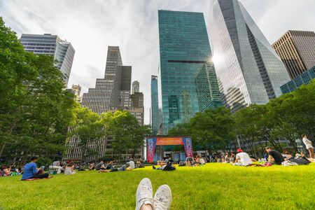 Bryant Park, Also Known as Manhattan's Town Square, NYC. Surrounded by iconic skyscrapers, Bryant Park is visited by more than 12 million people each year. New York City, May 24, 2019のeditorial素材