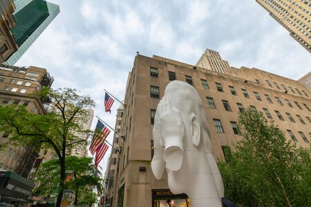 New York City/USA-May 28, 2019 Fifth Avenue, Rockefeller Plaza, Picture of Frieze Sculpture. Jaume Plensa - Behind the Walls.  Midtown of Manhattanのeditorial素材