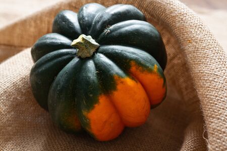 Squash. Fresh, organic Acorn Squash close up on rustic backgroundの写真素材